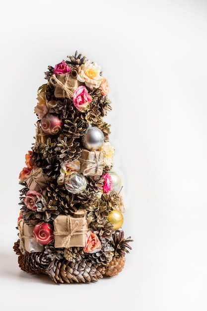 Homemade Christmas tree made of cones, Christmas toys and gifts - decoration for Christmas