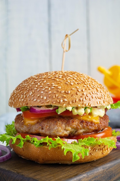 Homemade classic hamburger with beef cutlet cheese lettuce and tomato