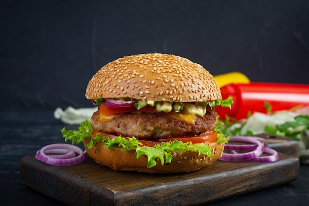 Homemade classic hamburger with beef cutlet cheese lettuce and tomato