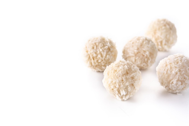 Homemade coconut balls isolated on white background