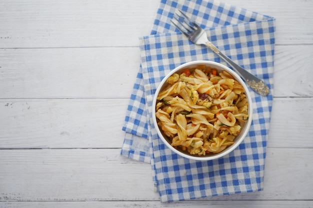 Homemade cooked pasta in a plate on table