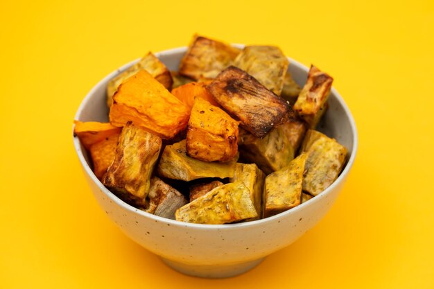 Homemade Cooked Sweet Potato with spices and herbs in smal bowl