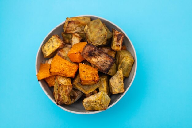 Homemade Cooked Sweet Potato with spices and herbs in smal bowl