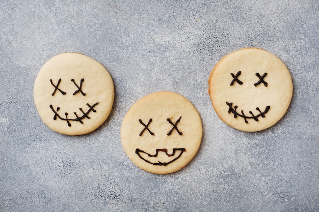 Homemade cookies for Halloween, Cookies with funny faces and spider webs