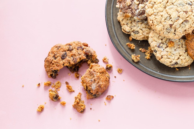 homemade cookies on plate on pink background