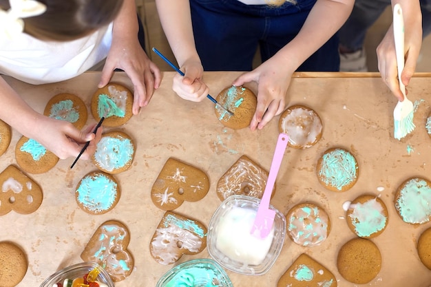 Homemade cookies with brown gingerbread for the holidays covered with icing and decorated with balls new Year's mood