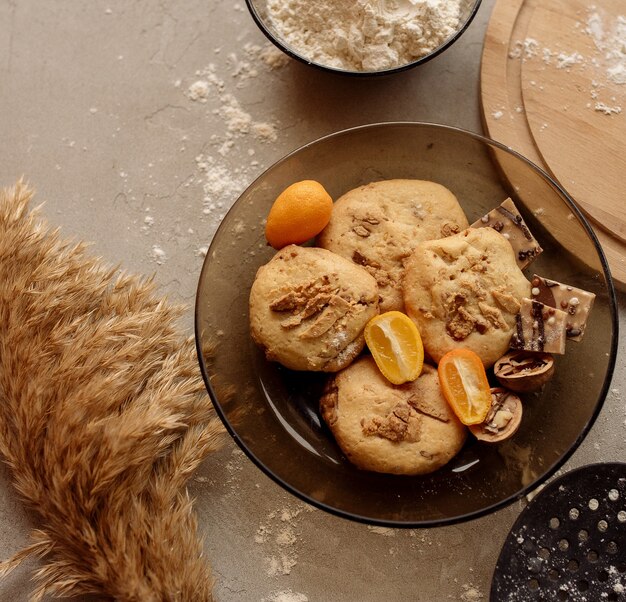 Homemade cookies with walnuts, kumquat and chocolate