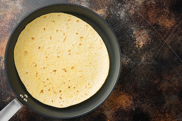 Photo homemade corn tortillas, on old dark rustic background, space for text