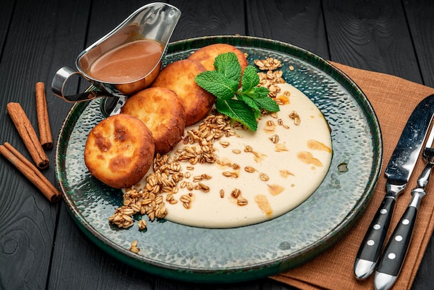 Homemade Cottage Cheese Pancakes with sweet sauce and granola