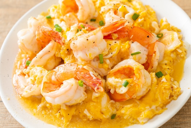 homemade creamy omelet with shrimps or scrambled eggs and shrimps