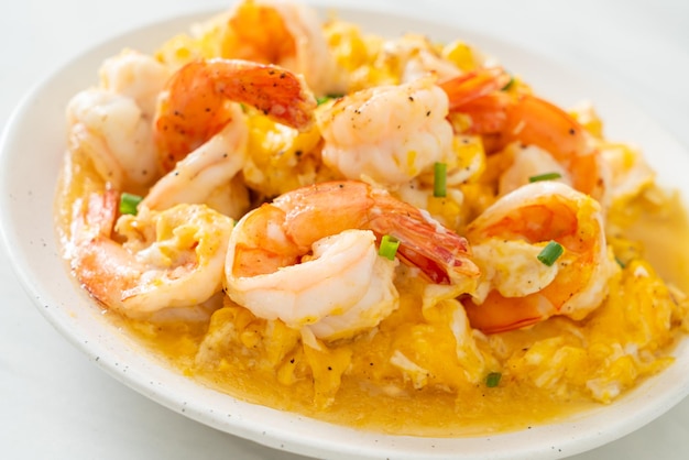 homemade creamy omelet with shrimps or scrambled eggs and shrimps