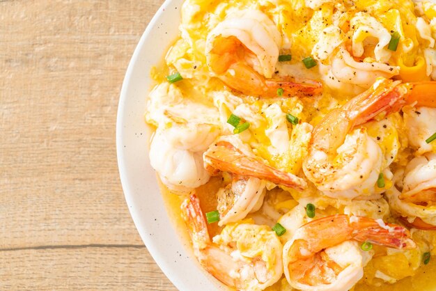 homemade creamy omelet with shrimps or scrambled eggs and shrimps