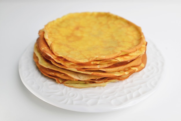 Homemade crepes on a white plate