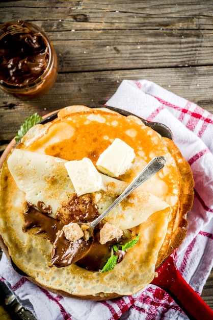 Homemade crepes with chocolate sauce