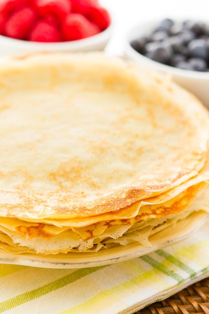 Homemade crepes with fresh raspberries and blueberries.