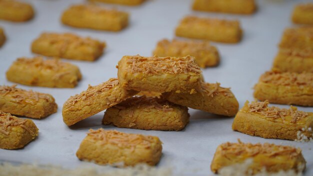 homemade crispy kaastengels cookies isolated on white background