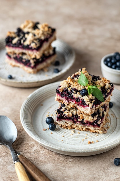 Homemade crumble bars on a plate decorated with mint healthy
food concept breakfast composition