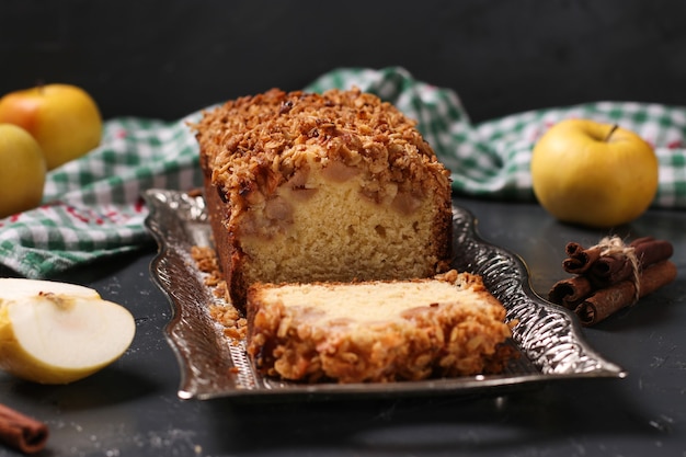 Homemade cupcake with oatmeal, apples and crunchy cereals oatmeal on a metal tray on a dark