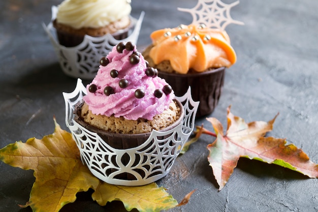 Homemade cupcakes with cream. on dark background.