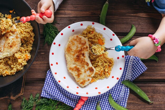 Homemade cutlets made of chicken breast, vegetables and fresh parsley. Healthy food for children