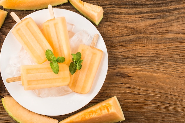 Homemade delicious ice lolly of cantaloupe melon. Healthy summer dessert.