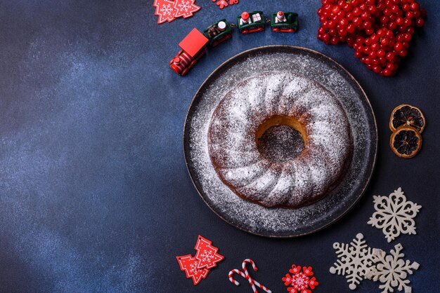 Homemade delicious round Christmas pie with red berries on a ceramic plate