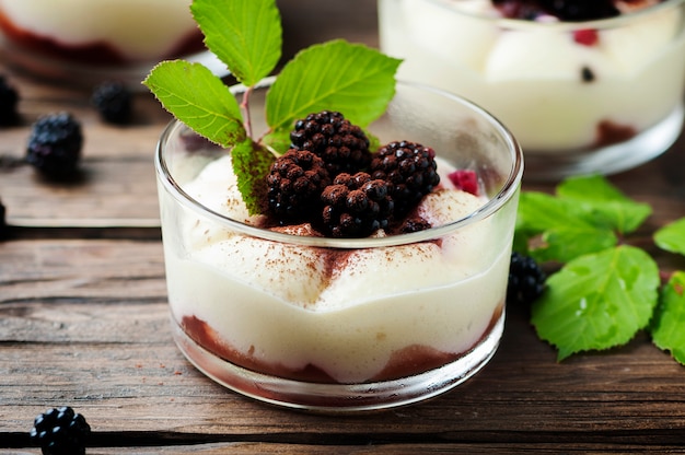 Homemade dessert with blackberry and cream