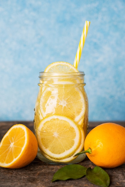 Homemade detox water with lemon in a glass jar