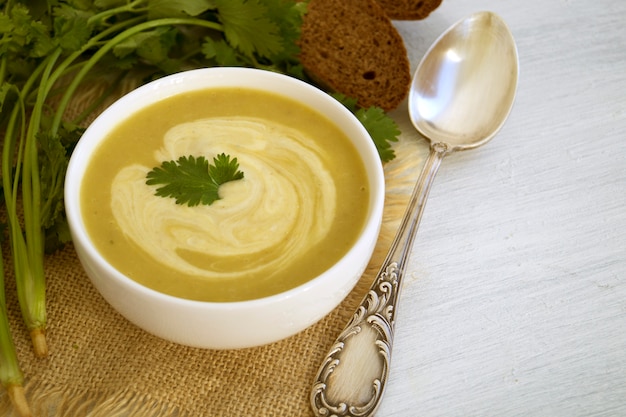 Photo homemade diet mushroom soup on a light background.