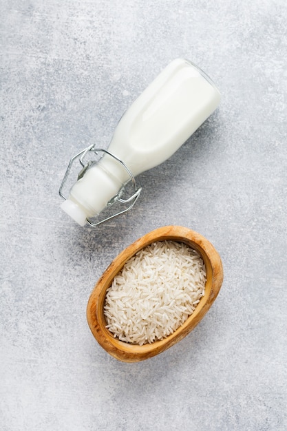 Homemade diet vegetable milk made from rice on a gray table