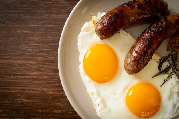 homemade double fried egg with fried pork sausage - for breakfast