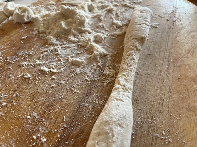 Homemade dough prepared and wheat flour for making dumplings