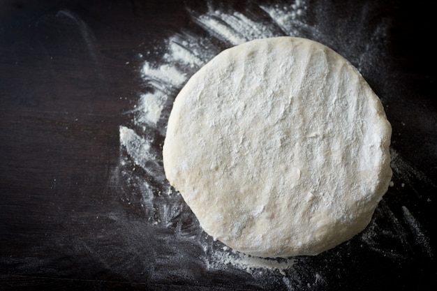 Homemade dough with rolling pin