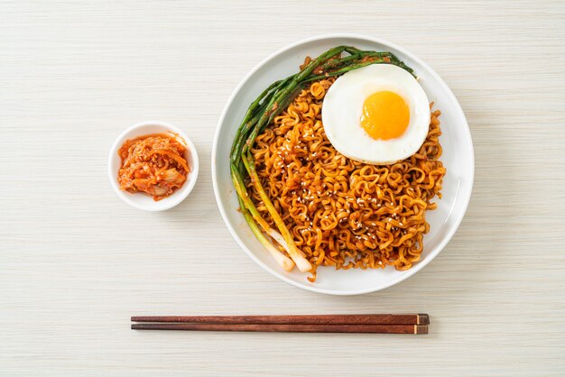 Homemade dried Korean spicy instant noodles with fried egg