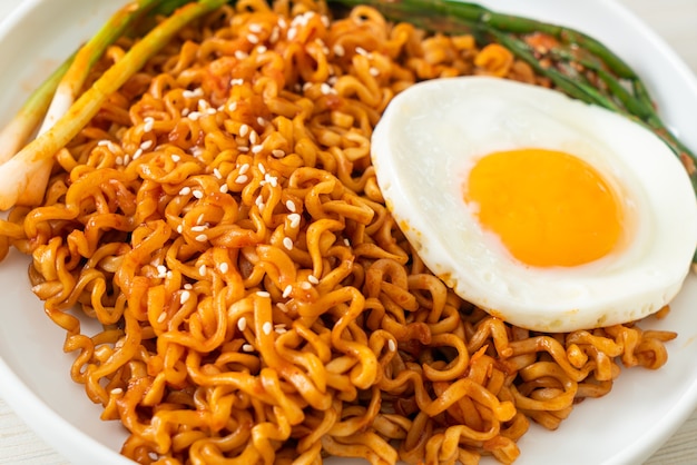 Homemade dried korean spicy instant noodles with fried egg