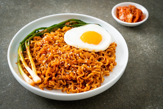 Homemade dried Korean spicy instant noodles with fried egg