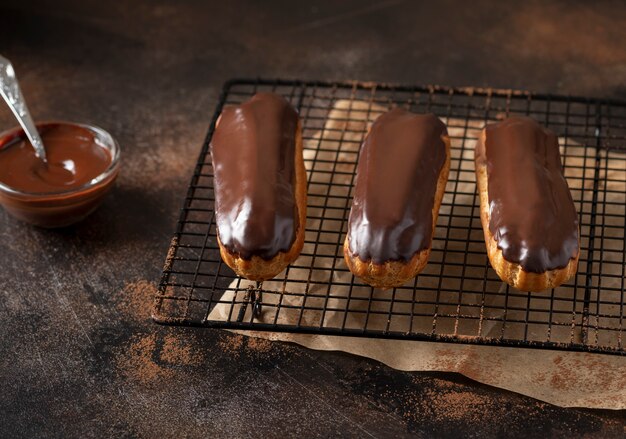 Homemade eclairs with cream and chocolate glaze