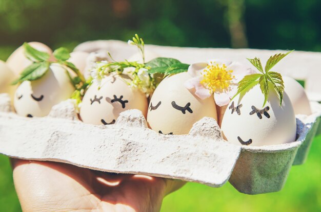 Homemade eggs with beautiful faces and a smile. Selective focus.