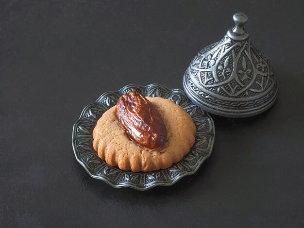 Homemade Eid Dates sweets on a black table