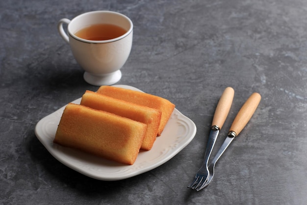 Homemade Financier Cake with Tea Copy Space for Text FInancier is French Cake with Butter