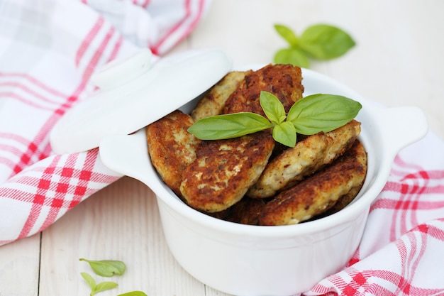 Homemade fish cutlets in a bowl