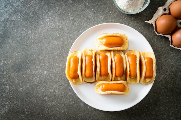 homemade flat pancake roll with sausage