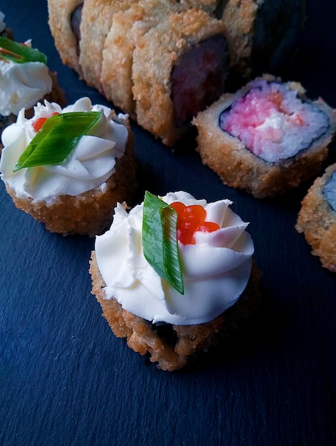 Homemade food Rolls with red caviar and cream cheese