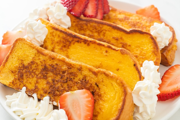 homemade french toast with fresh strawberry and whipping cream