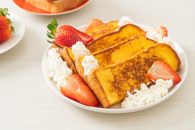 homemade french toast with fresh strawberry and whipping cream