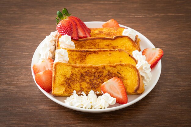 homemade french toast with fresh strawberry and whipping cream