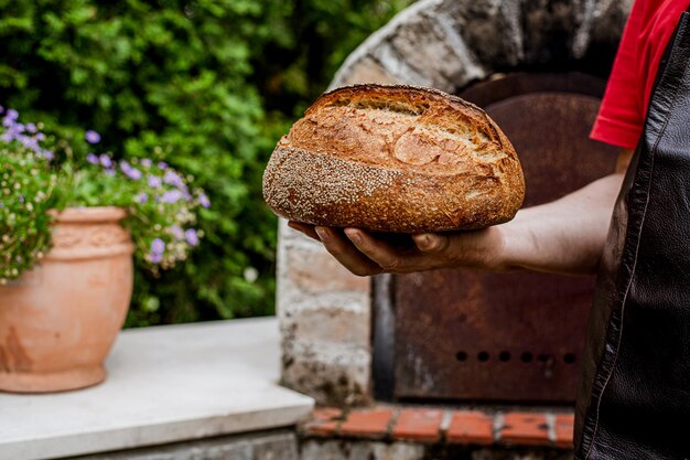 Homemade fresh bread in the baker39s hand