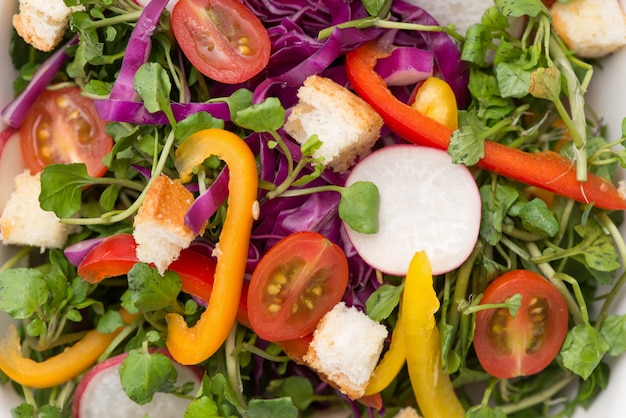 Homemade fresh green vegetable salad on table. Close-up.