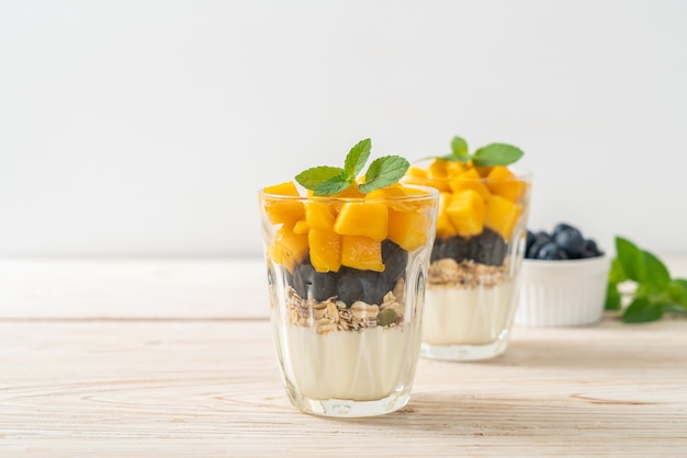 homemade fresh mango and fresh blueberry with yogurt and granola