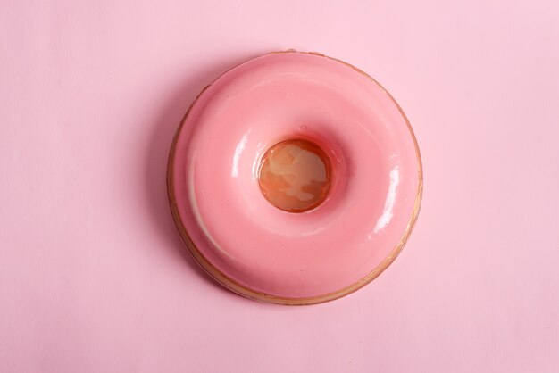 Homemade freshly prepared pink glazed souffle from natural berries and fruits on the same color background.